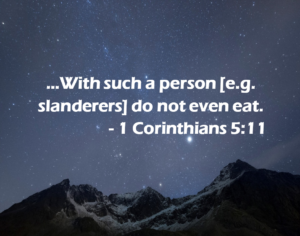 Starry night sky over snow-capped mountains with the verse '...With such a person [e.g. slanderers] do not even eat. - 1 Corinthians 5:11'