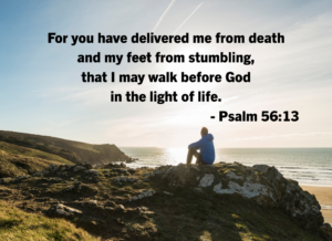 Psalm 5613 | Fountain of Life A person in a blue jacket sits on rocky coastal cliffs at sunset, with Psalm 56:13 text overlaid: 'For you have delivered me from death... life.' (assumes faith-based message)
